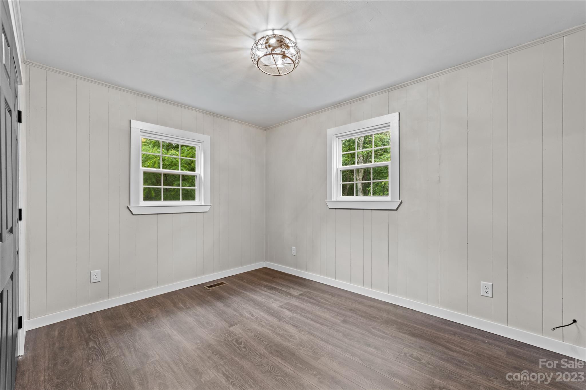 1809 Feature Road Lancaster, SC 29720 - Photo 24 of 32 wooden floor in an empty room with a window