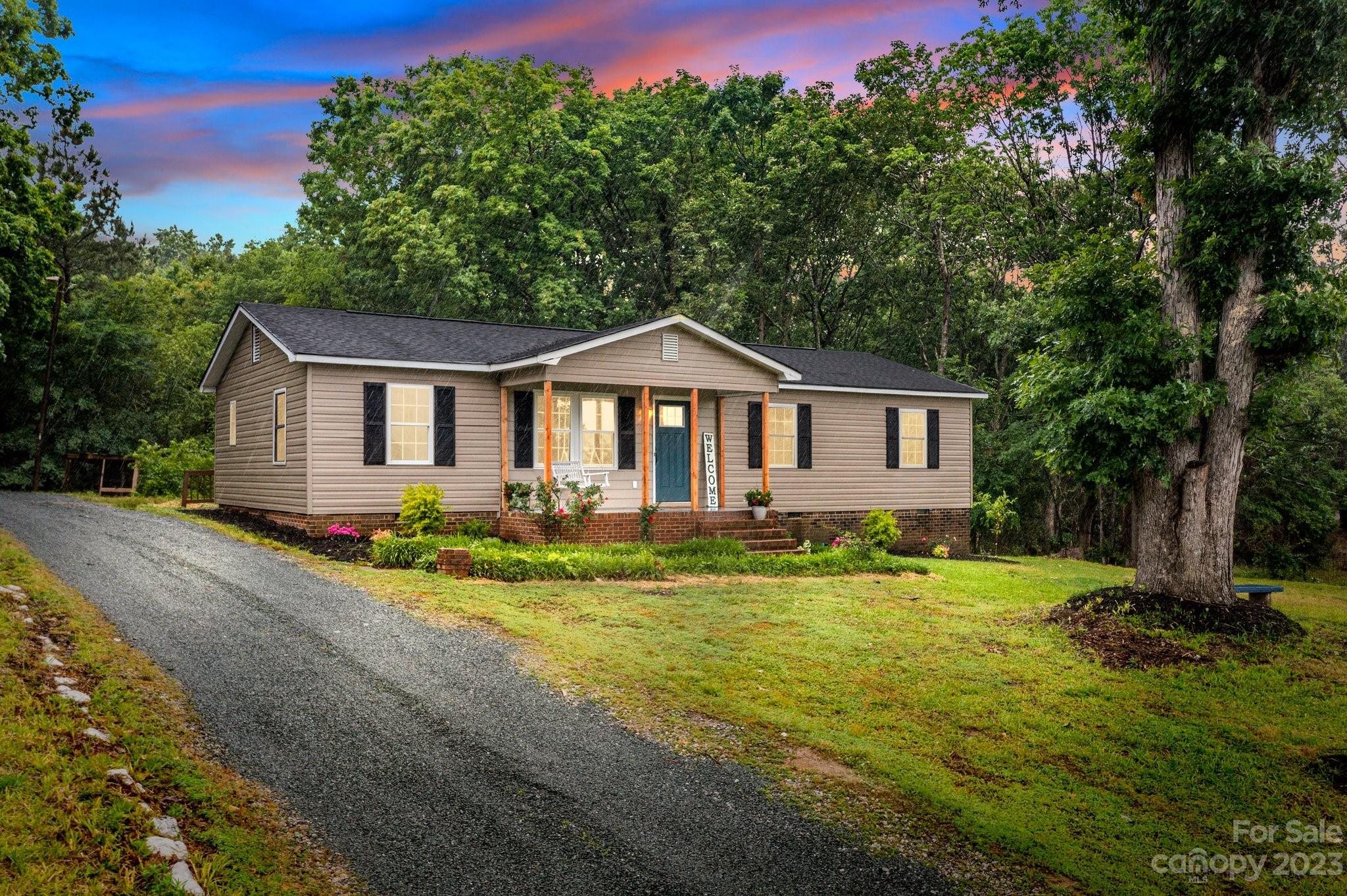 1809 Feature Road Lancaster, SC 29720 - Photo 32 of 32 a front view of a house with a yard and garage