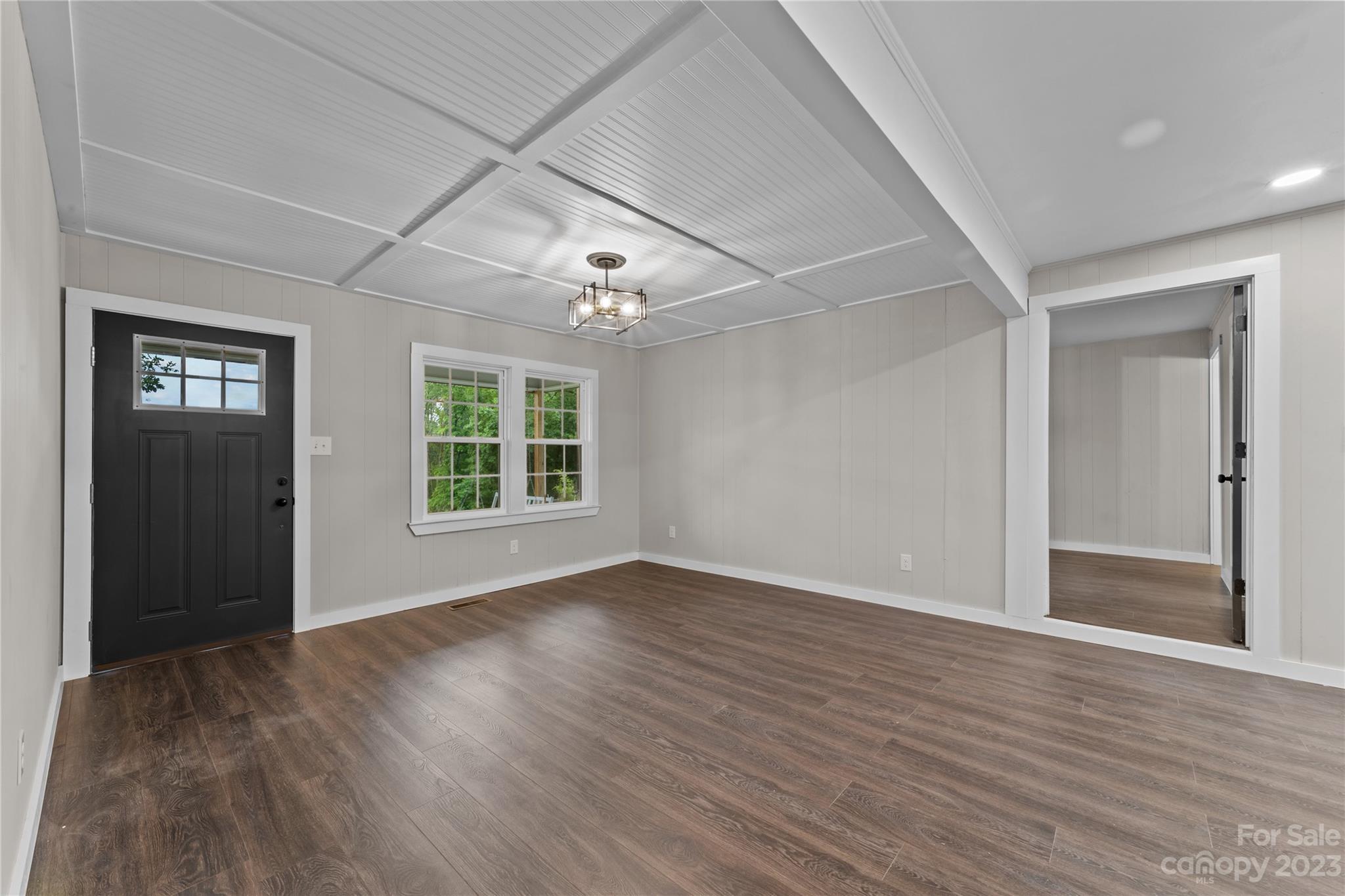 1809 Feature Road Lancaster, SC 29720 - Photo 7 of 32 a view of an empty room with wooden floor and a window