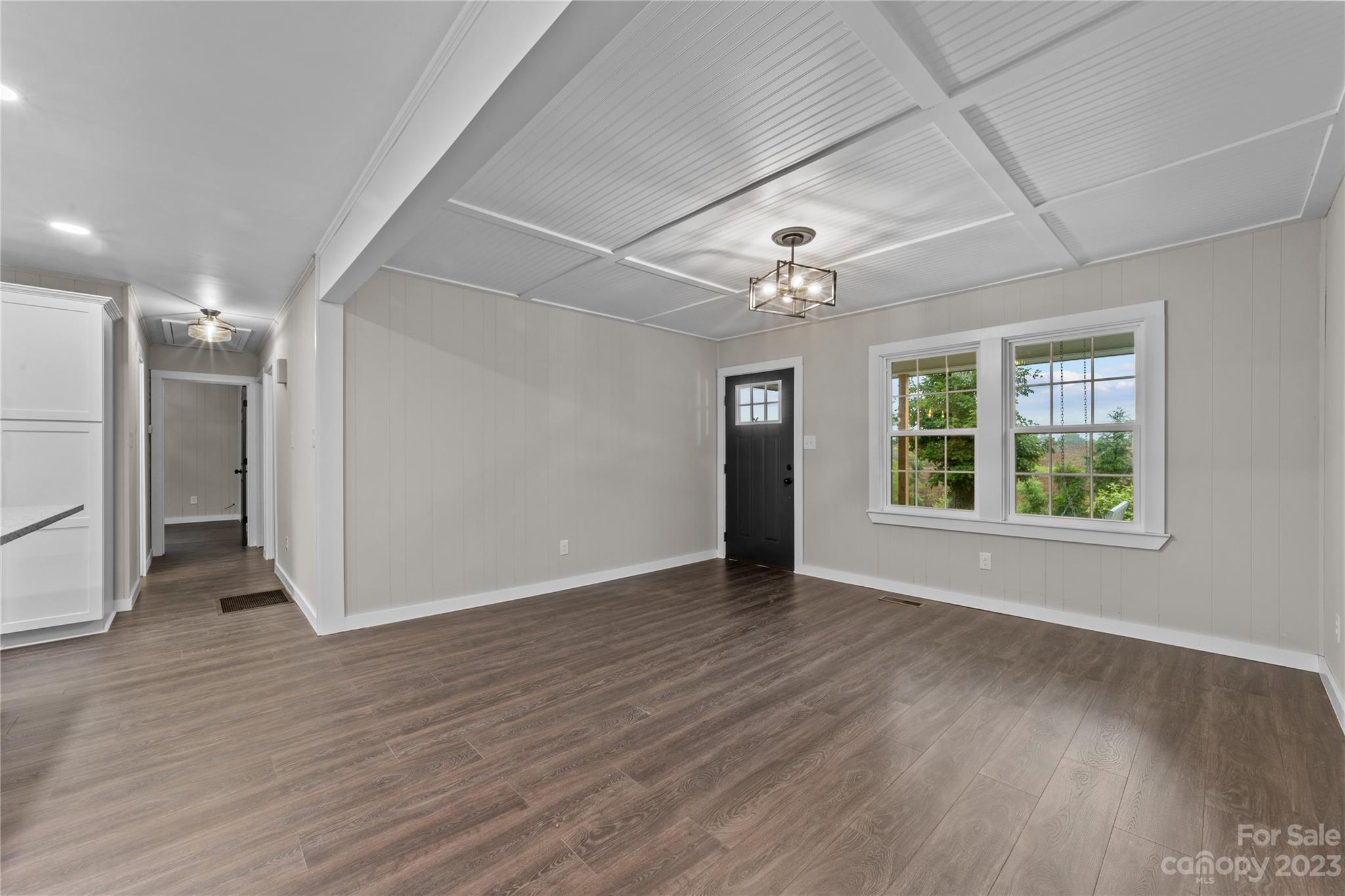 1809 Feature Road Lancaster, SC 29720 - Photo 8 of 32 a view of an empty room with wooden floor and a window