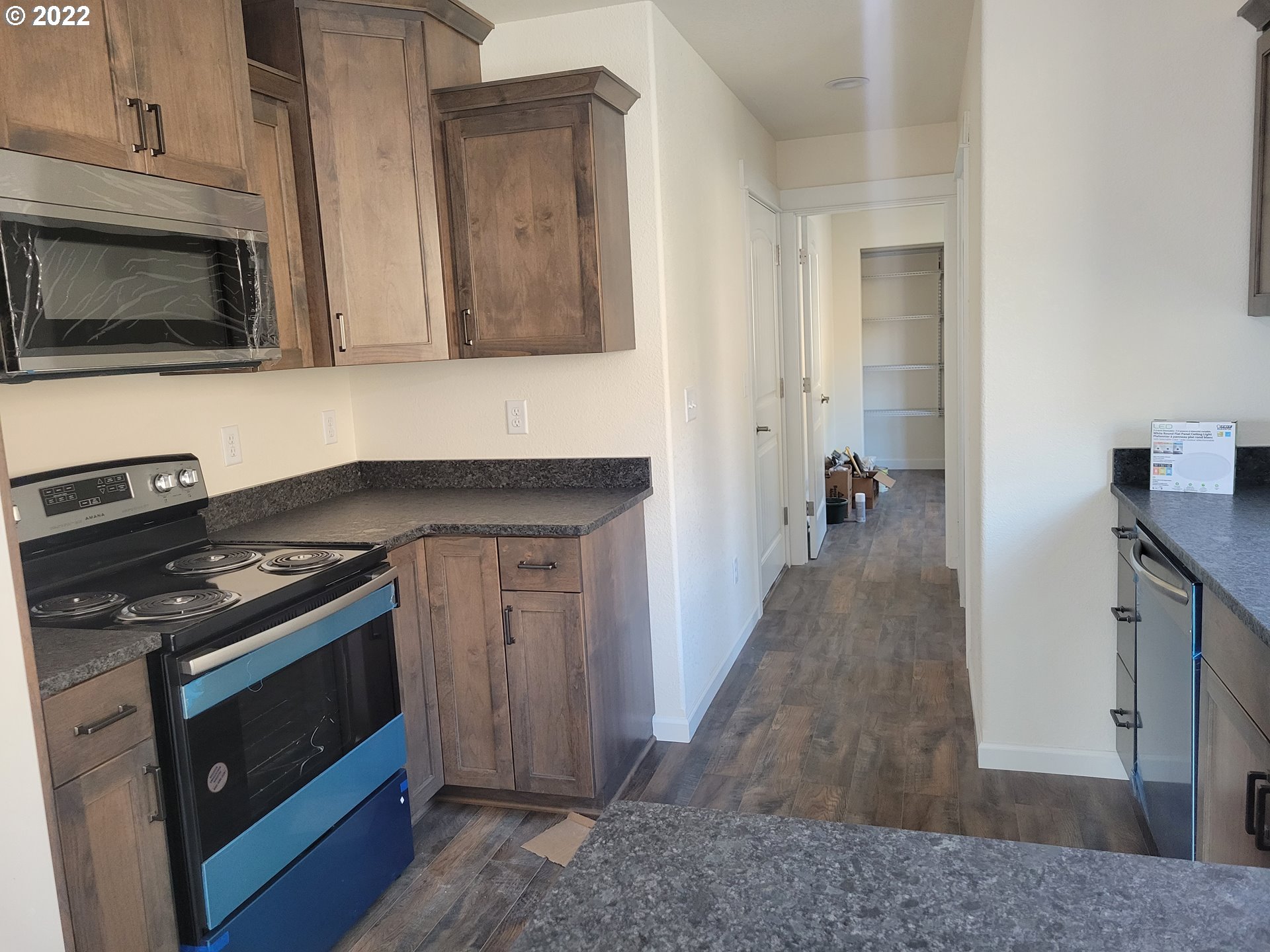 195 Armande Loop Roseburg, OR 97471 - Photo 11 of 28 a kitchen with a stove and a microwave