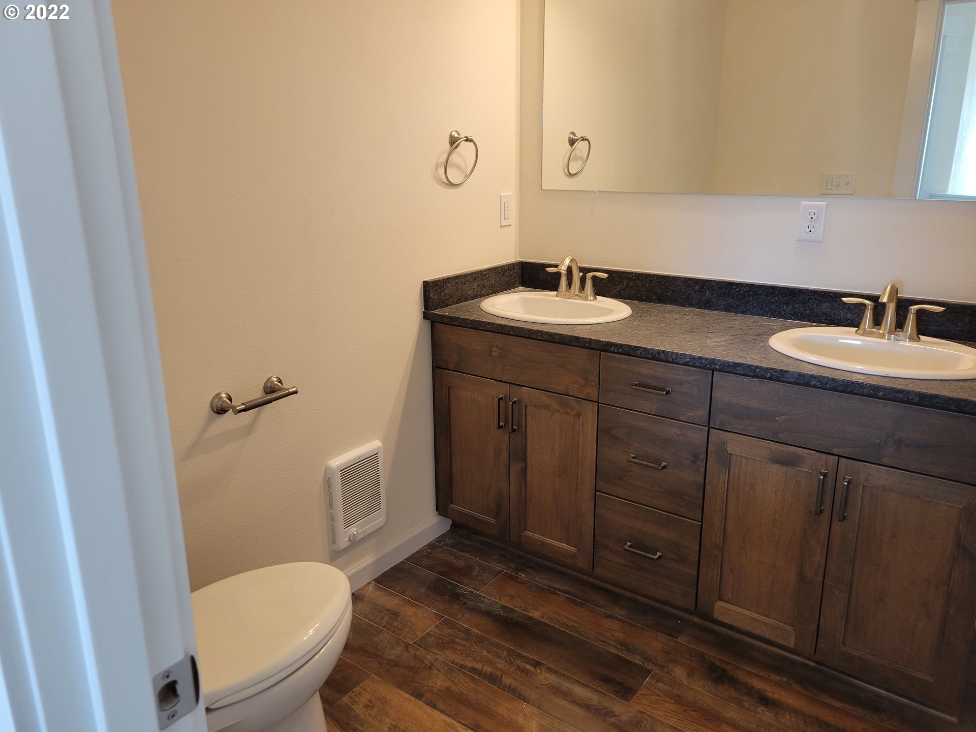 195 Armande Loop Roseburg, OR 97471 - Photo 17 of 28 a bathroom with a granite countertop toilet sink and mirror