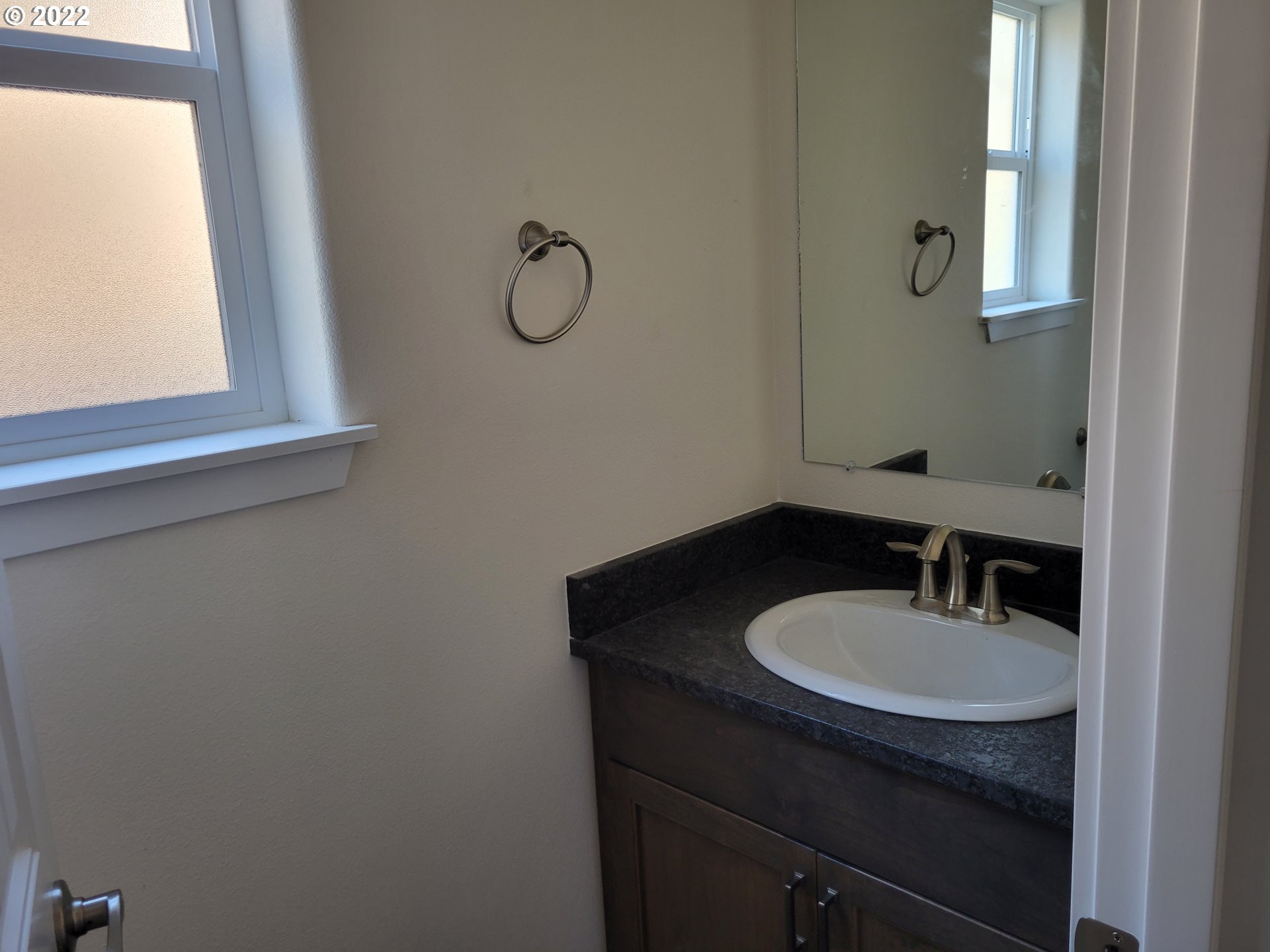 195 Armande Loop Roseburg, OR 97471 - Photo 8 of 28 a bathroom with a sink a mirror and a window