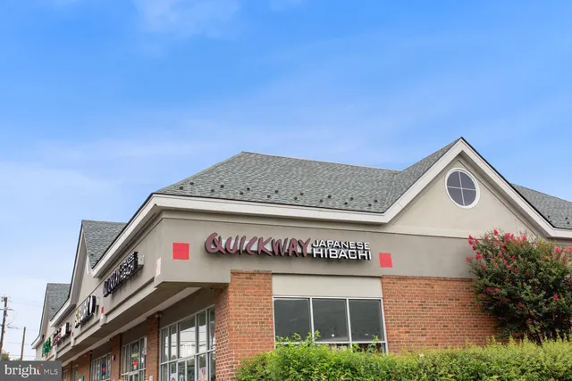 a utility room with stainless steel appliances and a sink