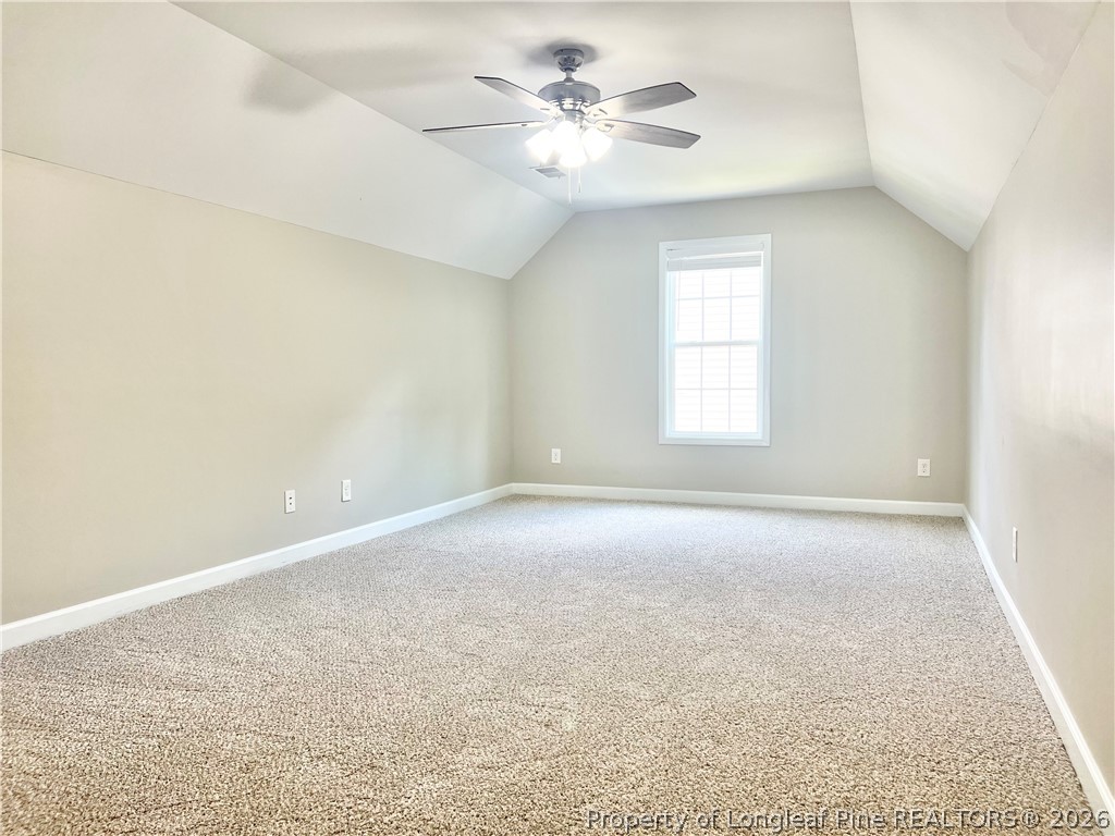 1523 Rough Rider Lane Parkton, NC 28371 - Photo 38 of 42 an empty room with a window and a ceiling fan