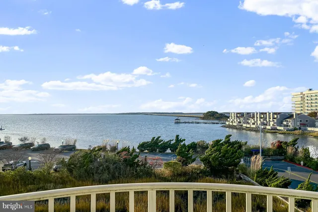a bedroom with furniture and a mirror