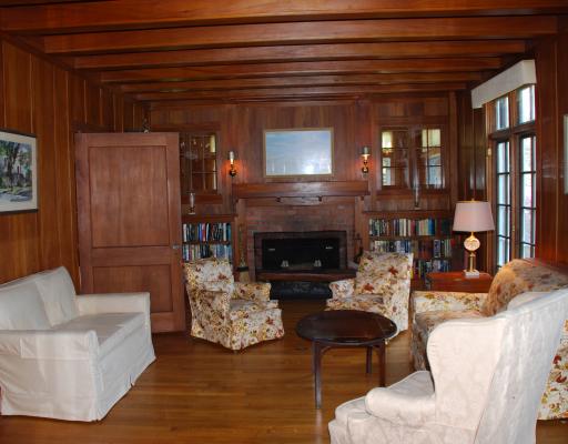 65 Whittier Road Jamestown, RI 02835 - Photo 3 of 10 Living Room. Charming living room with beamed ceilings, fireplace and french doors to porch