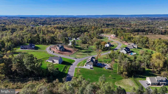 an aerial view of a town with couple of houses