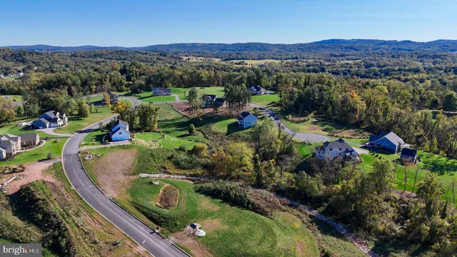 an aerial view of a house with a garden