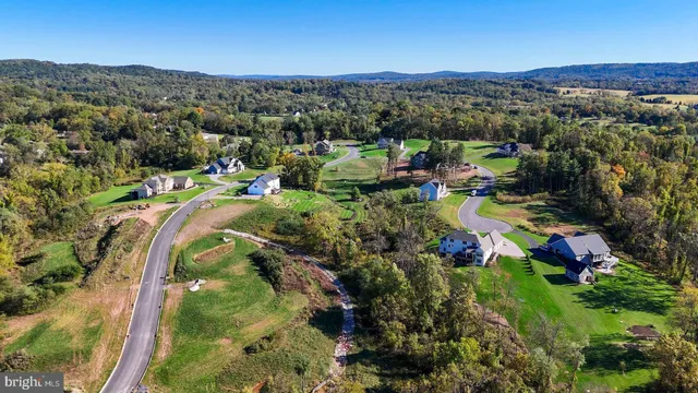 a view of a town with mountains in the background