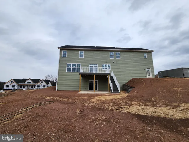 a view of a house with a road
