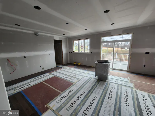 a bedroom with furniture and windows