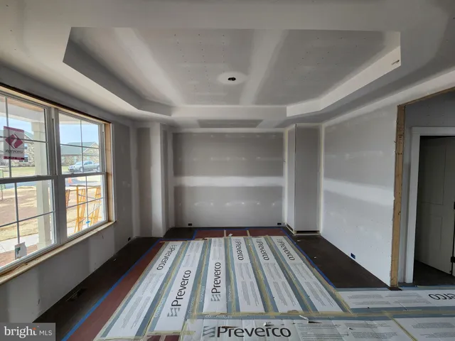 a view of a room with wooden floor and staircase