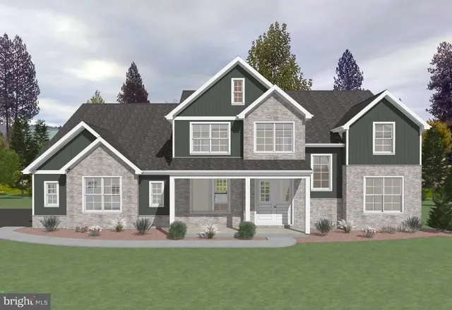 a front view of a house with a yard potted plants and wooden fence