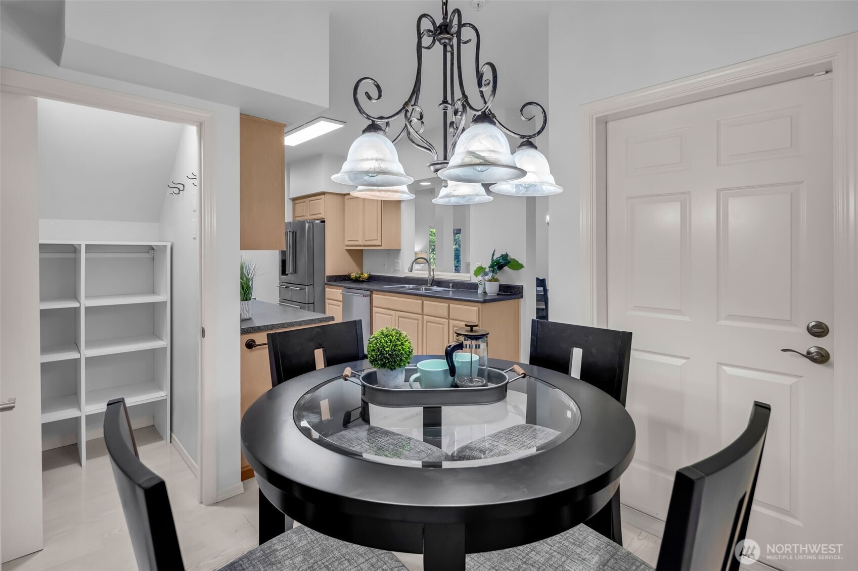 4212 221st Place Southeast, Unit 1561 Issaquah, WA 98029 - Photo 18 of 35 a view of a dining room with furniture a chandelier and wooden floor