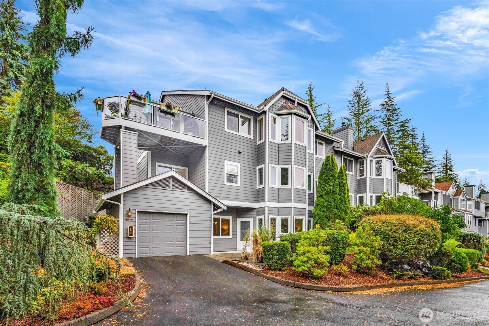 4212 221st Place Southeast, Unit 1561 Issaquah, WA 98029 - Photo 2 of 35 front view of a house with a street