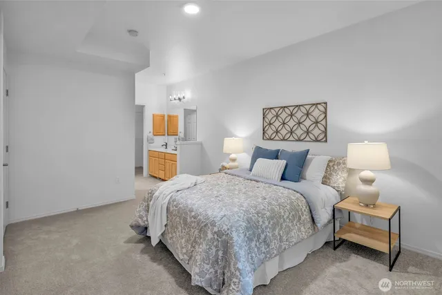 a bathroom with a sink a toilet and mirror