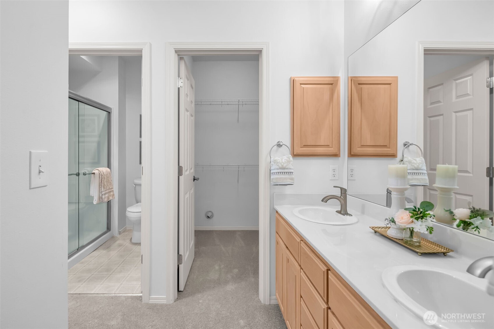 4212 221st Place Southeast, Unit 1561 Issaquah, WA 98029 - Photo 23 of 35 a bathroom with a sink and a mirror