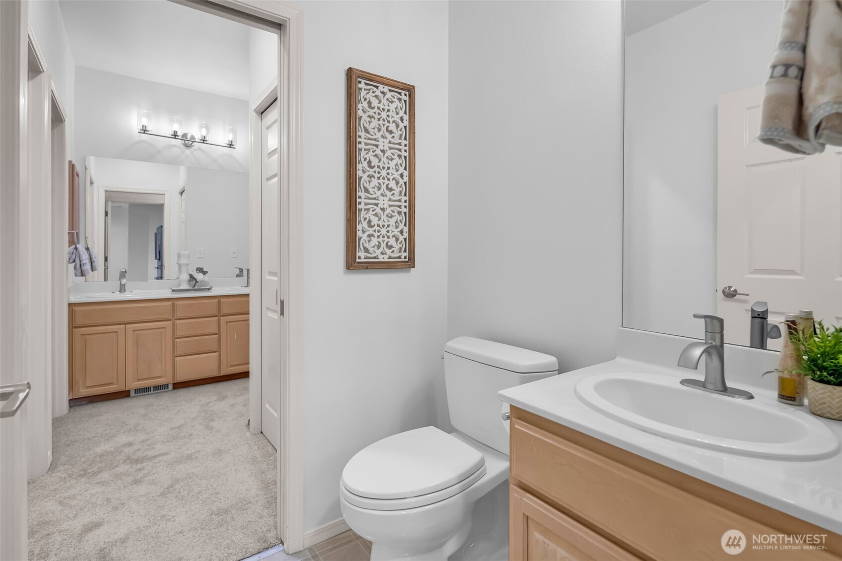 4212 221st Place Southeast, Unit 1561 Issaquah, WA 98029 - Photo 24 of 35 a bathroom with a sink a toilet and mirror