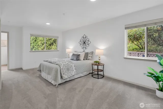 a bedroom with a bed and a couch