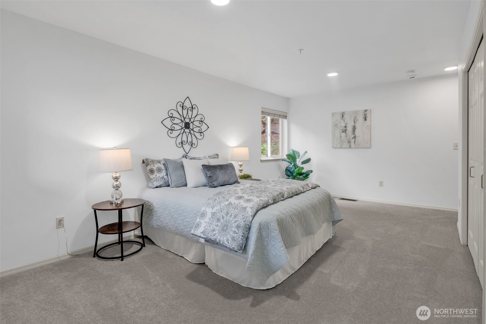 4212 221st Place Southeast, Unit 1561 Issaquah, WA 98029 - Photo 29 of 35 a spacious bedroom with a bed and a window