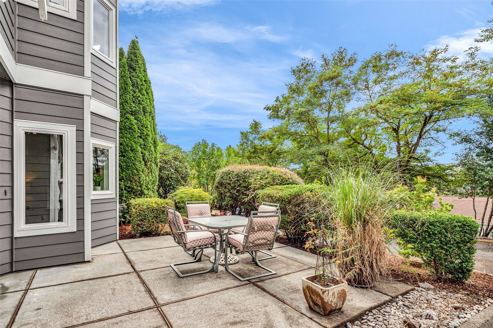 4212 221st Place Southeast, Unit 1561 Issaquah, WA 98029 - Photo 33 of 35 a view of a chairs and table in a backyard