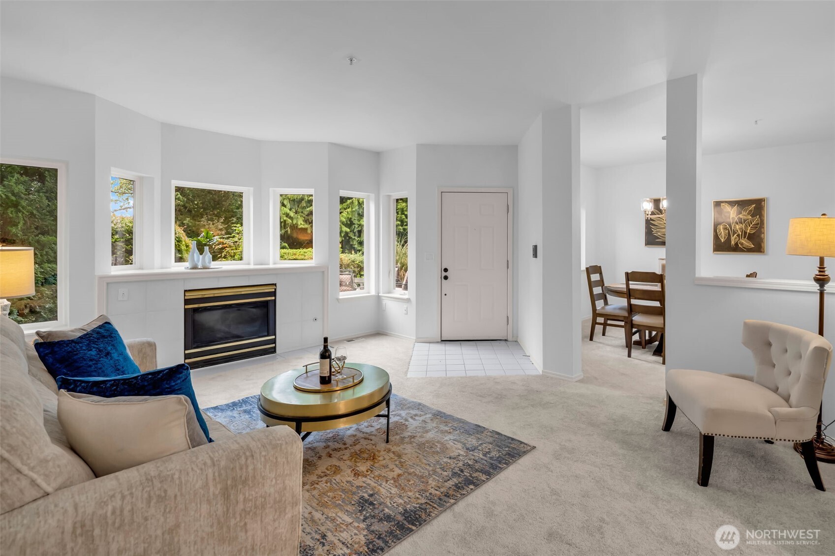 4212 221st Place Southeast, Unit 1561 Issaquah, WA 98029 - Photo 6 of 35 a living room with furniture a fireplace and a table