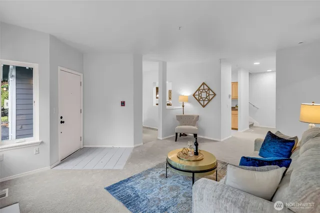 a view of a dining room with furniture and chandelier