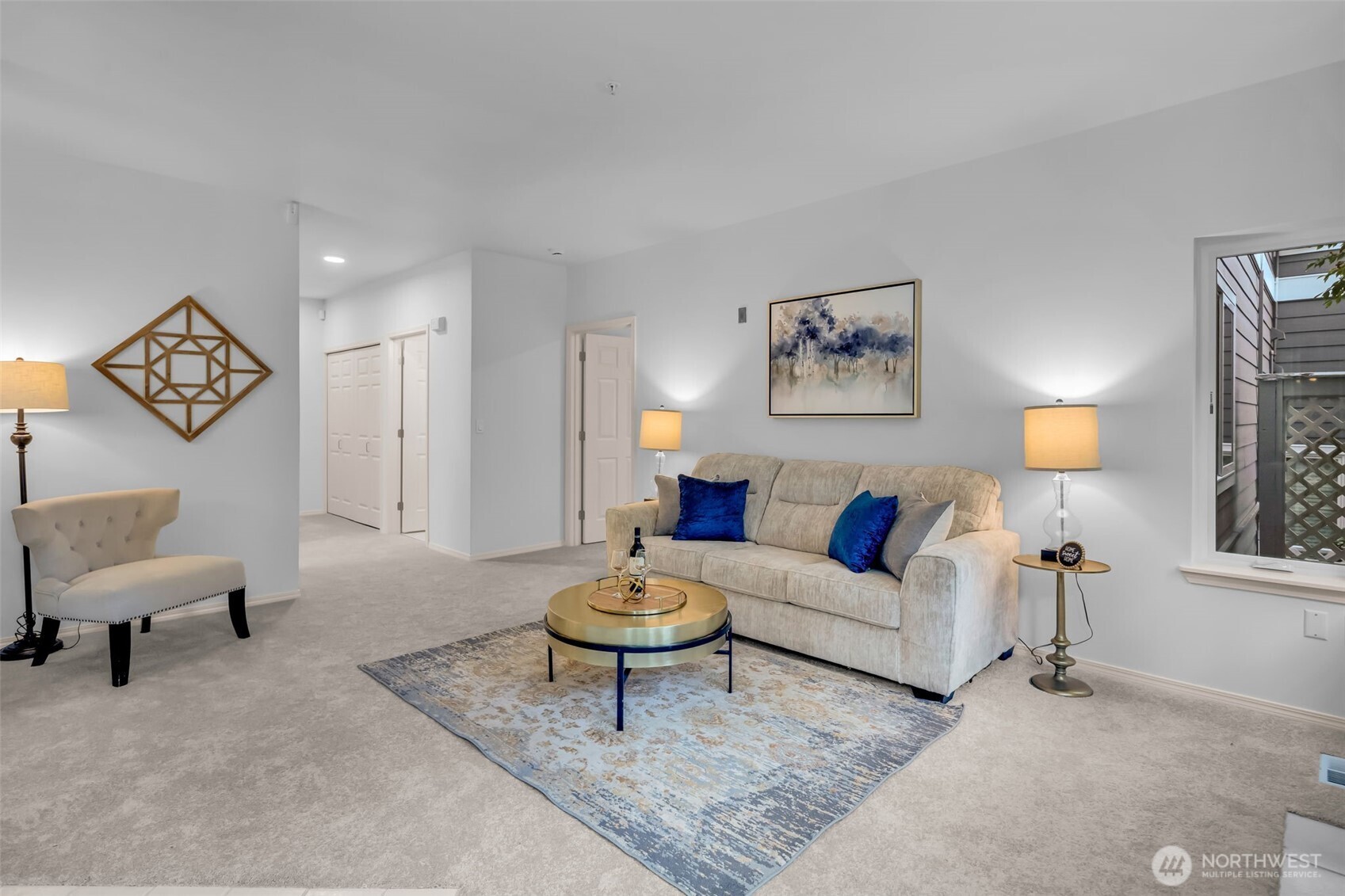 4212 221st Place Southeast, Unit 1561 Issaquah, WA 98029 - Photo 8 of 35 a living room with furniture a rug and a lamp