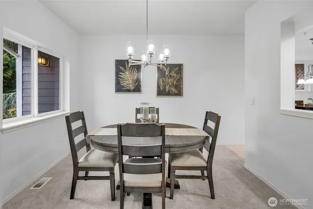 a view of a dining room with furniture window and outside view