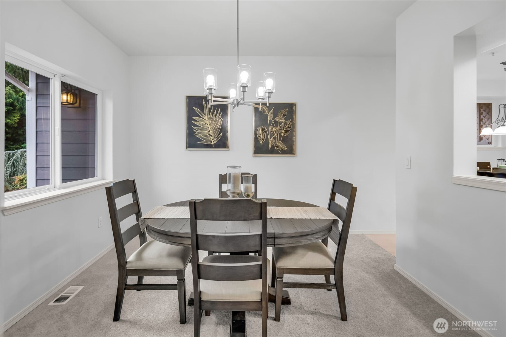 4212 221st Place Southeast, Unit 1561 Issaquah, WA 98029 - Photo 9 of 35 a view of a dining room with furniture and chandelier