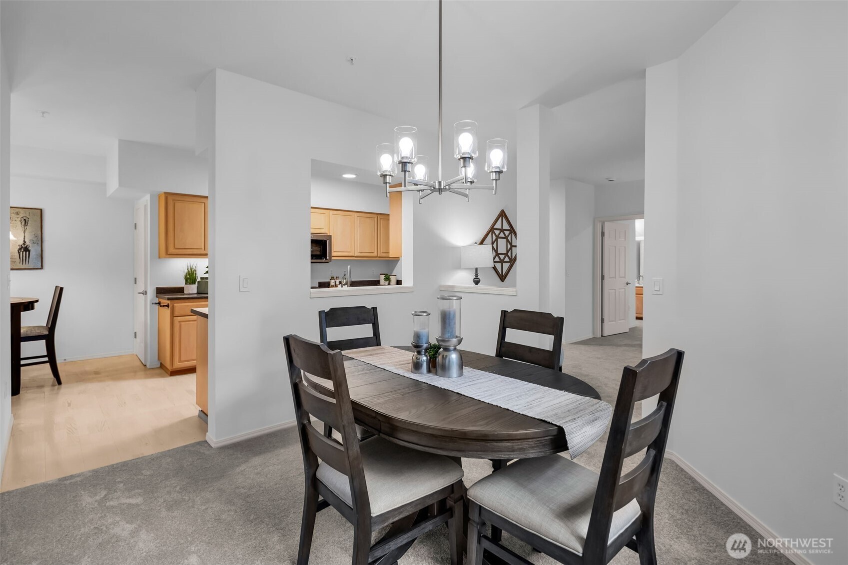 4212 221st Place Southeast, Unit 1561 Issaquah, WA 98029 - Photo 10 of 35 a view of a dining room with furniture and a chandelier