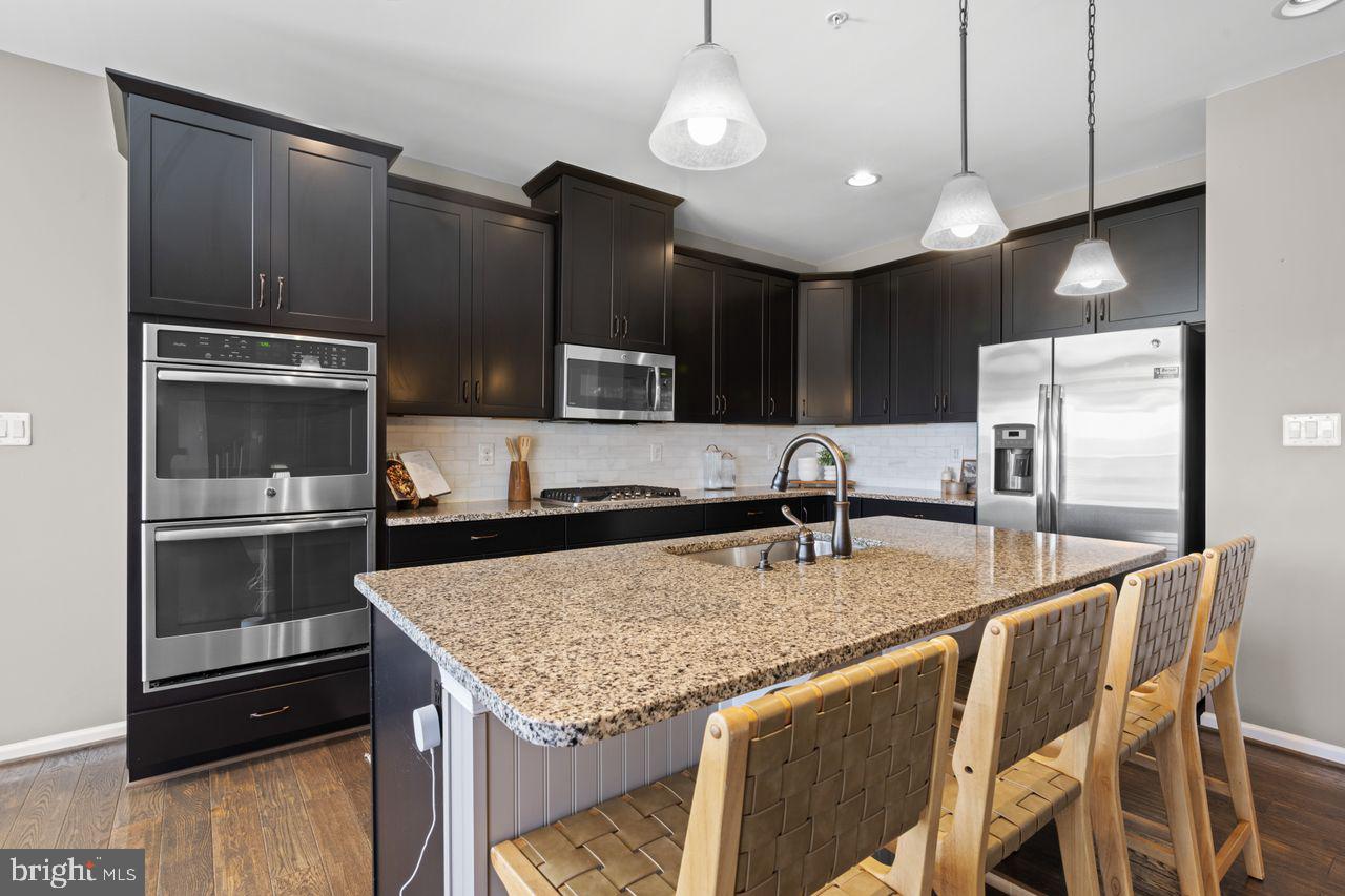 3026 Sunny Ridge Drive Odenton, MD 21113 - Photo 11 of 49 Sleek modern kitchen with granite island.