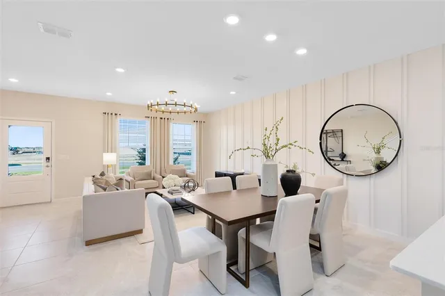 a dining room with wooden floor a chandelier a wooden table and chairs