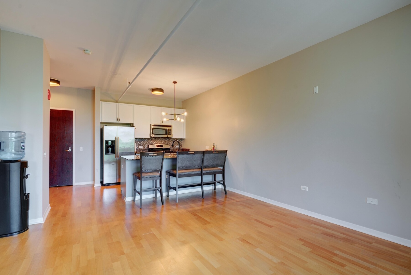 437 West Division Street, Unit 412 Chicago, IL 60610 - Photo 3 of 11 a view of a kitchen with dining table and chairs