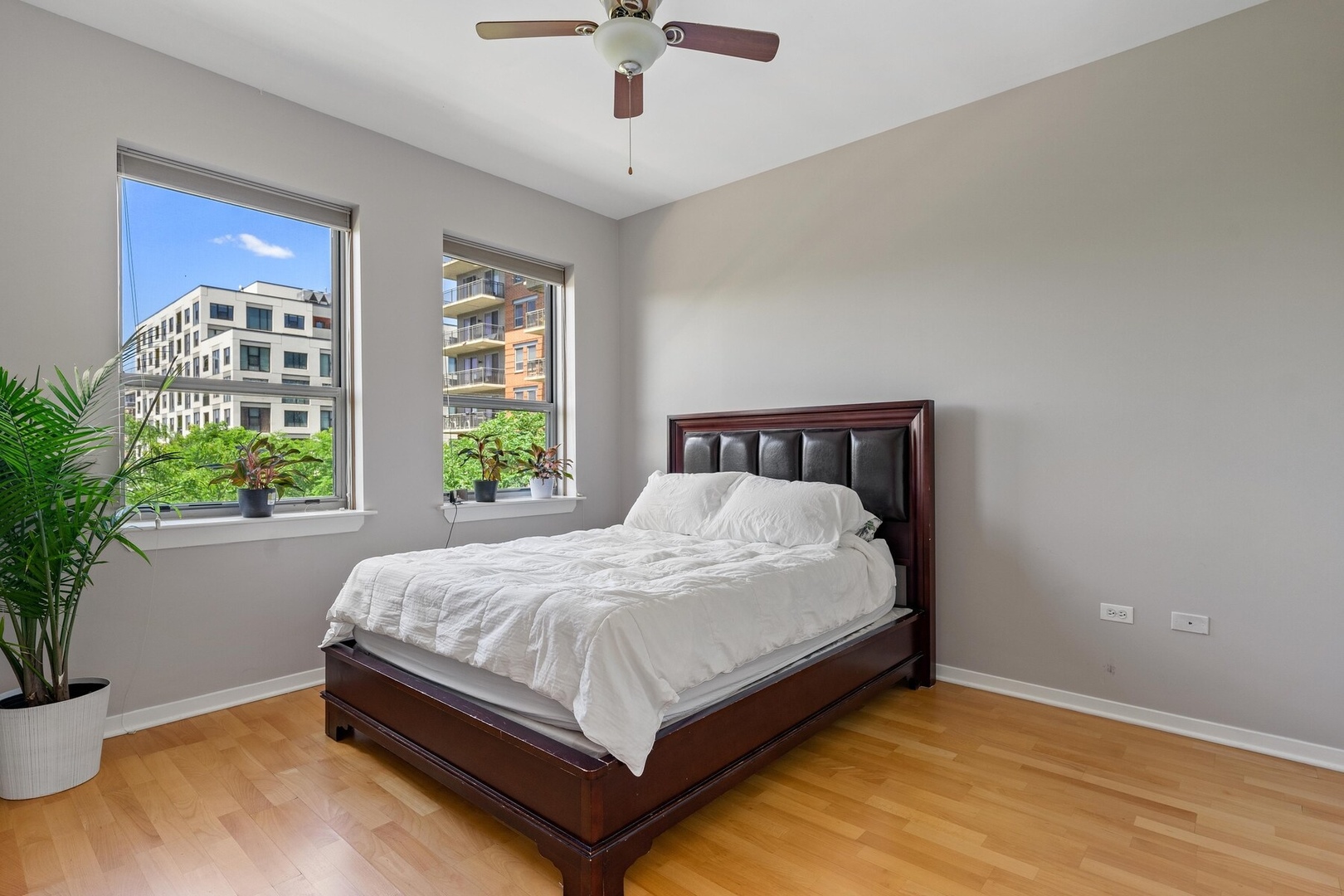 437 West Division Street, Unit 412 Chicago, IL 60610 - Photo 5 of 11 a bed sitting in a bedroom next to a window