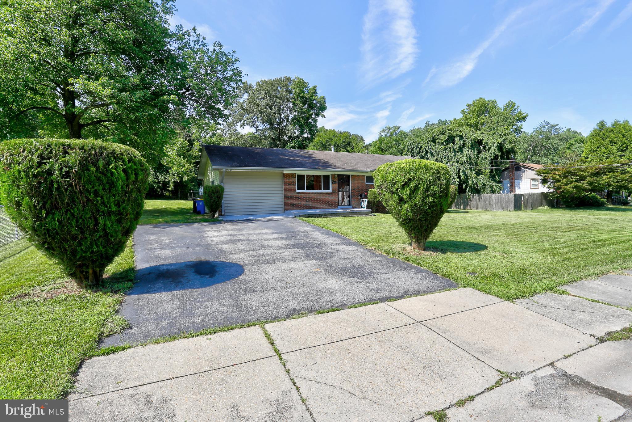 6609 Woodland Road Morningside, MD 20746 - Photo 2 of 30 a view of a house with a yard