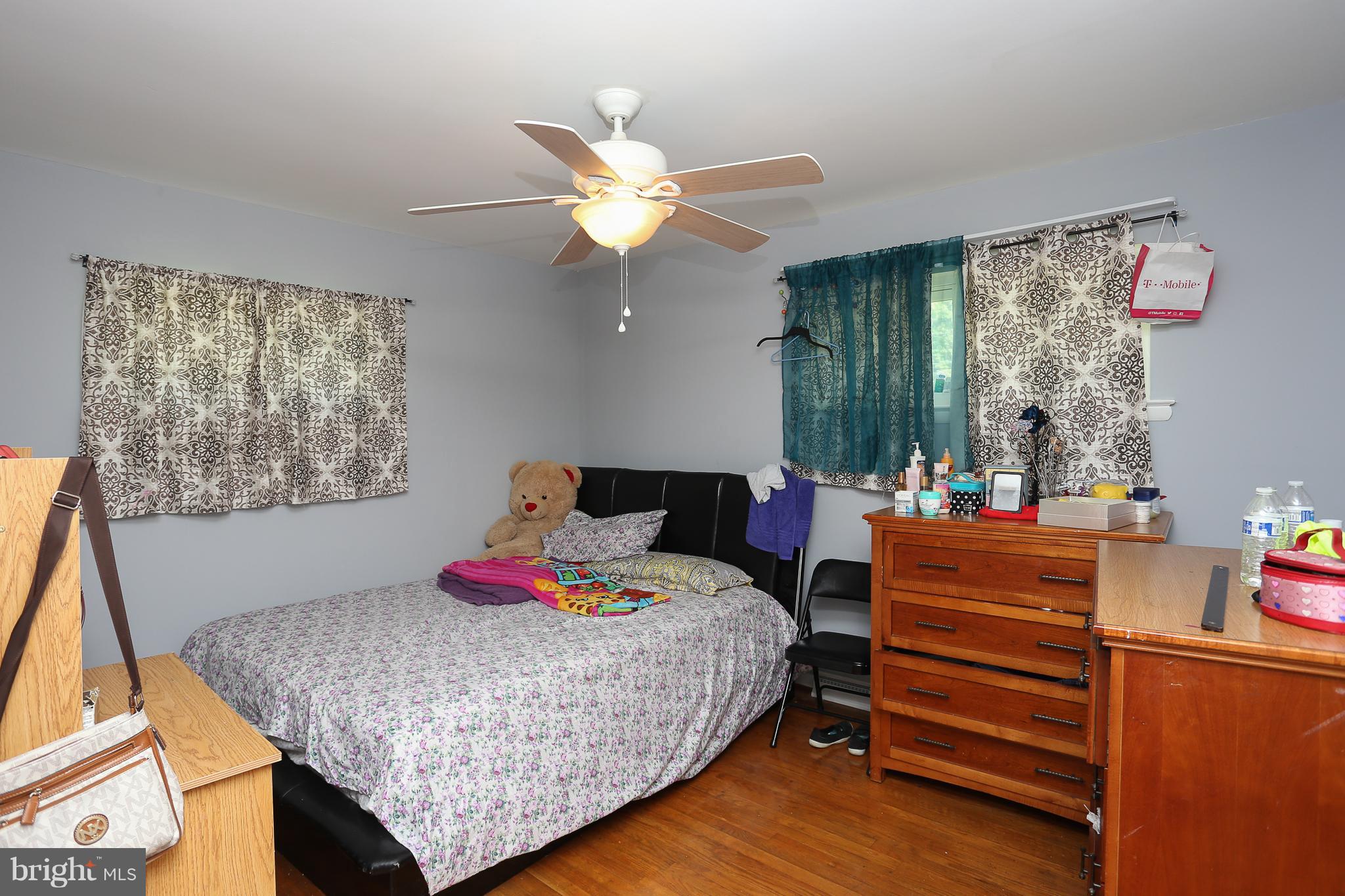 6609 Woodland Road Morningside, MD 20746 - Photo 15 of 30 a bedroom with a bed and a dresser