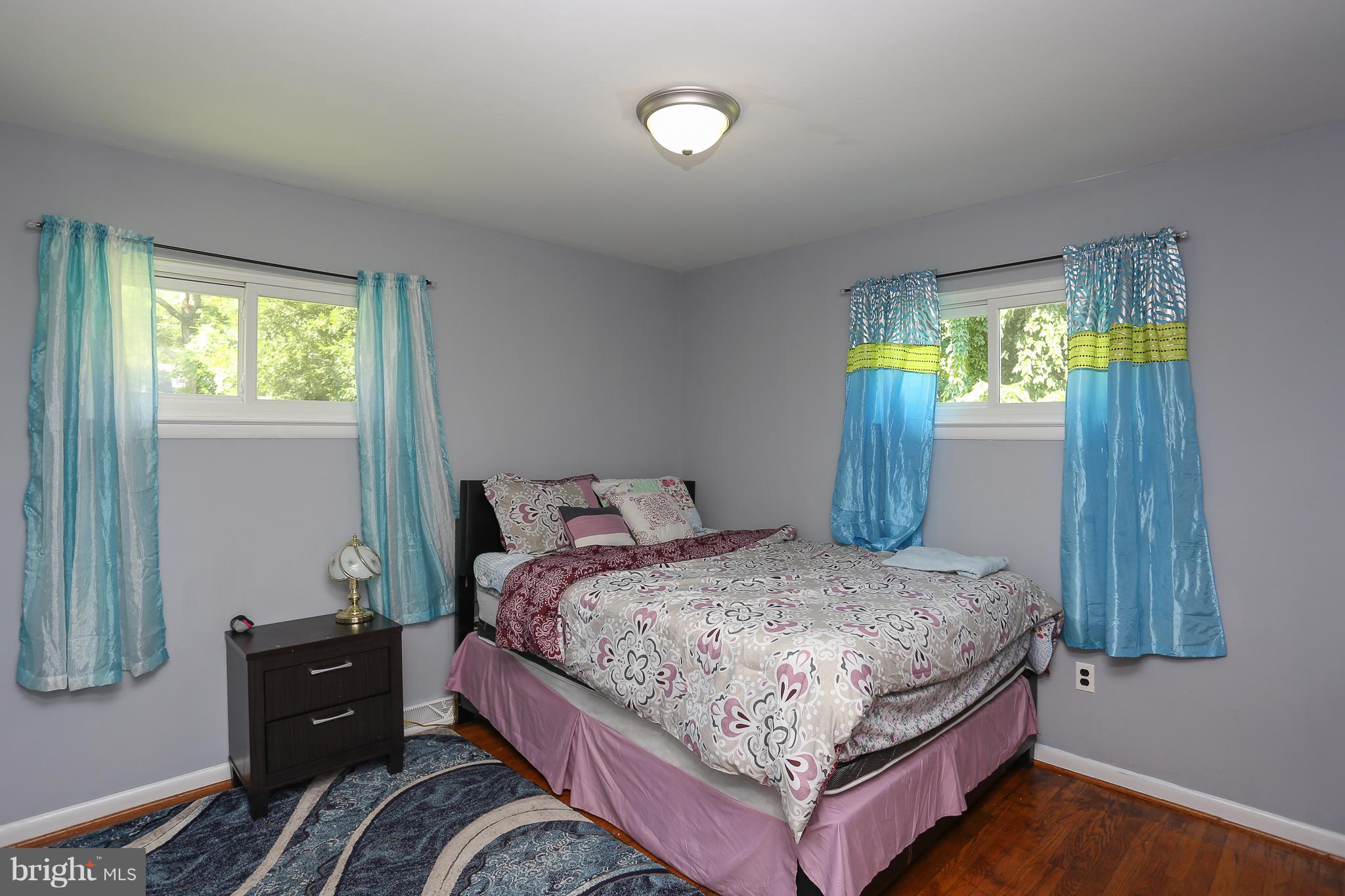 6609 Woodland Road Morningside, MD 20746 - Photo 17 of 30 a bedroom with a bed and a window