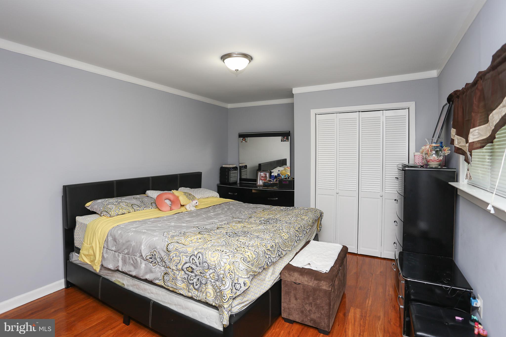 6609 Woodland Road Morningside, MD 20746 - Photo 21 of 30 a bedroom with a bed and dresser