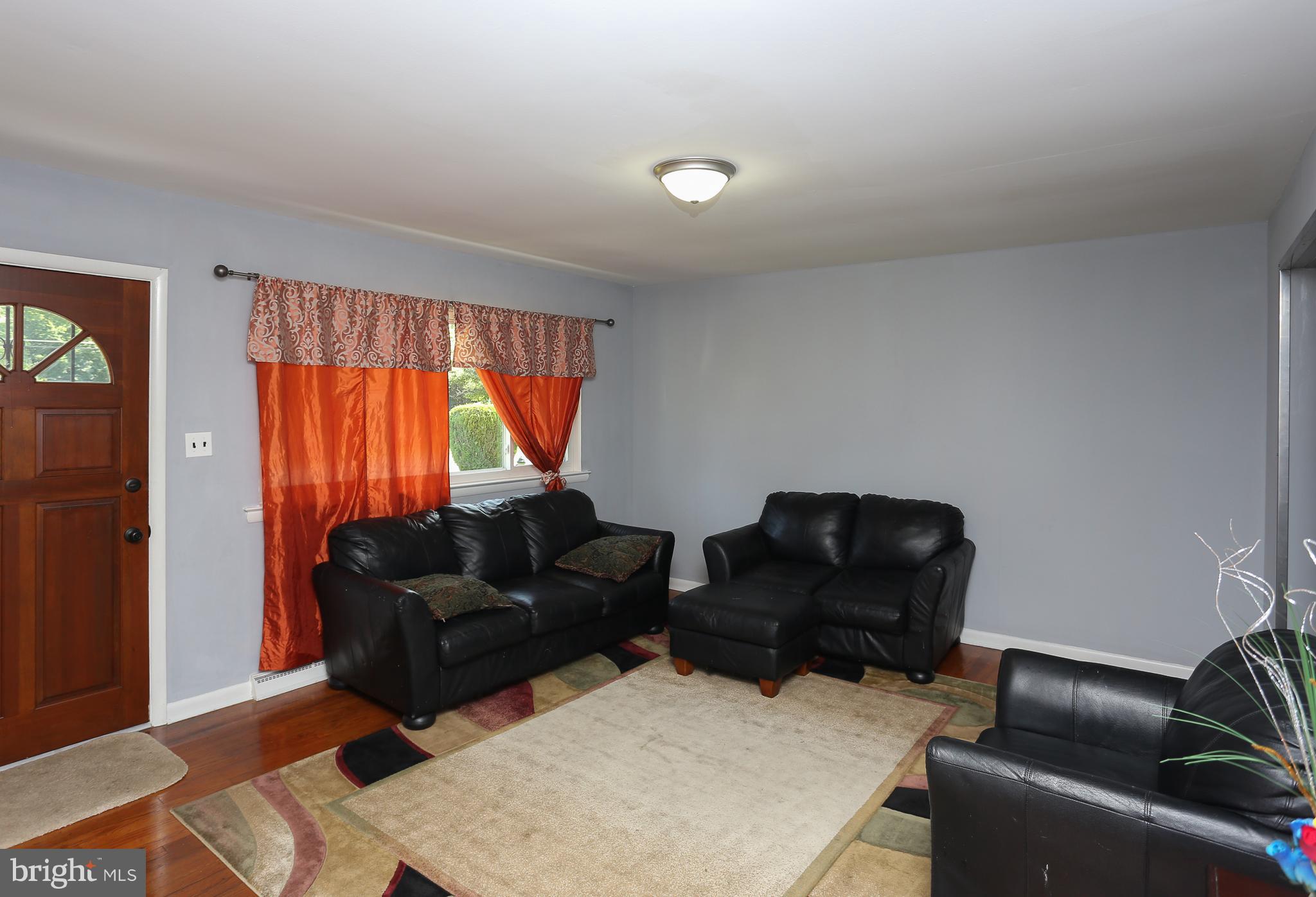 6609 Woodland Road Morningside, MD 20746 - Photo 5 of 30 a living room with furniture and a window