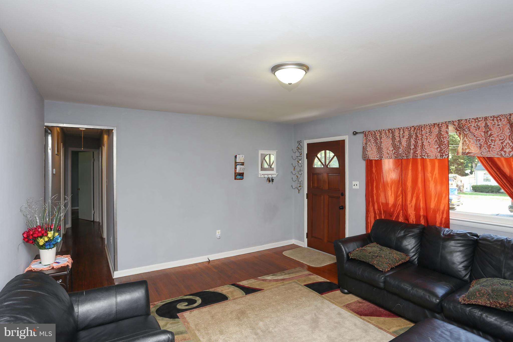 6609 Woodland Road Morningside, MD 20746 - Photo 7 of 30 a living room with furniture and a window