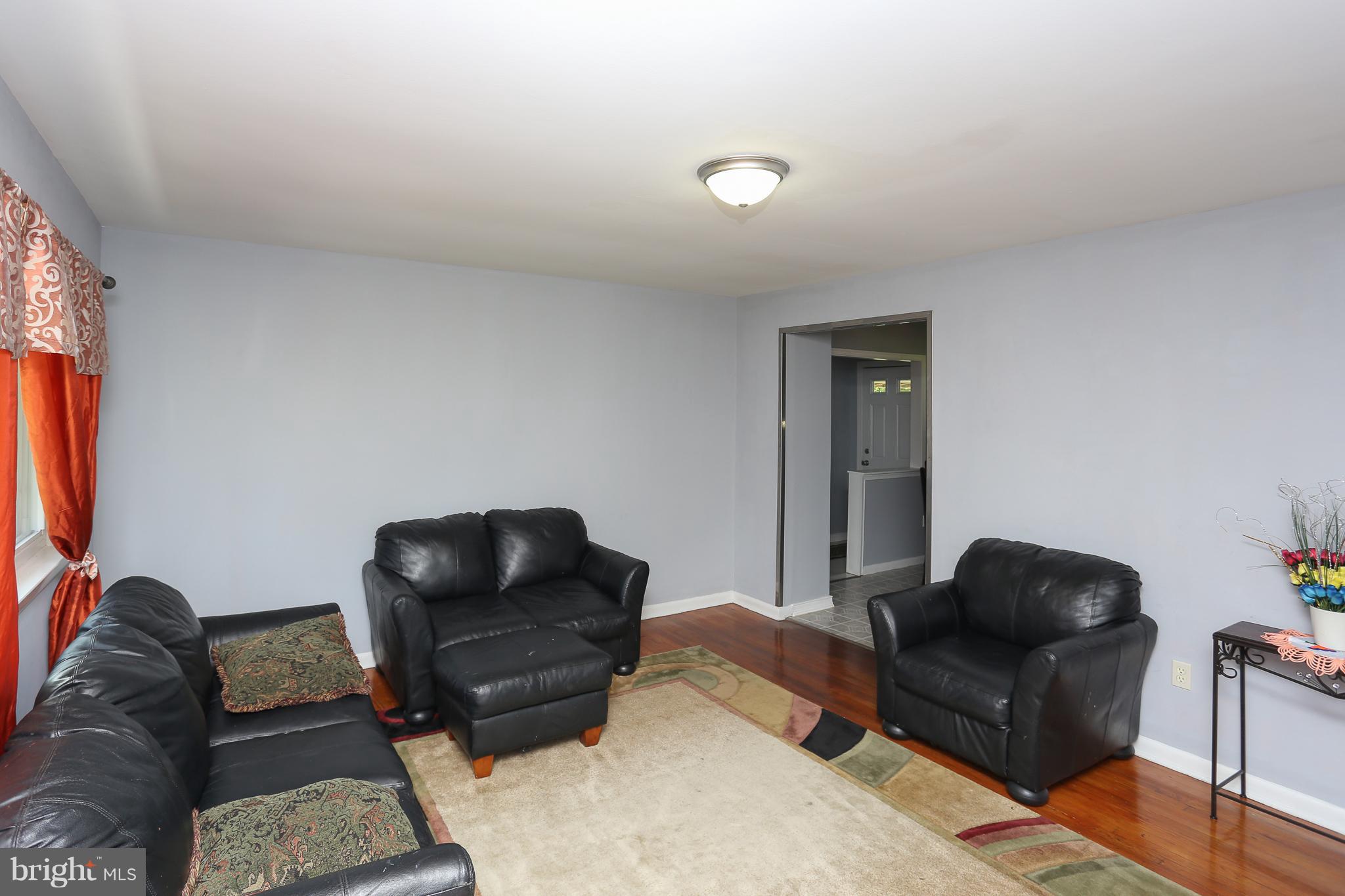 6609 Woodland Road Morningside, MD 20746 - Photo 9 of 30 a living room with furniture and a couch