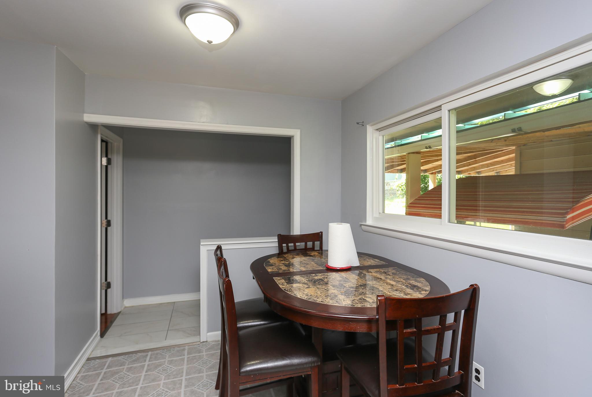 6609 Woodland Road Morningside, MD 20746 - Photo 10 of 30 a dining room with furniture and window