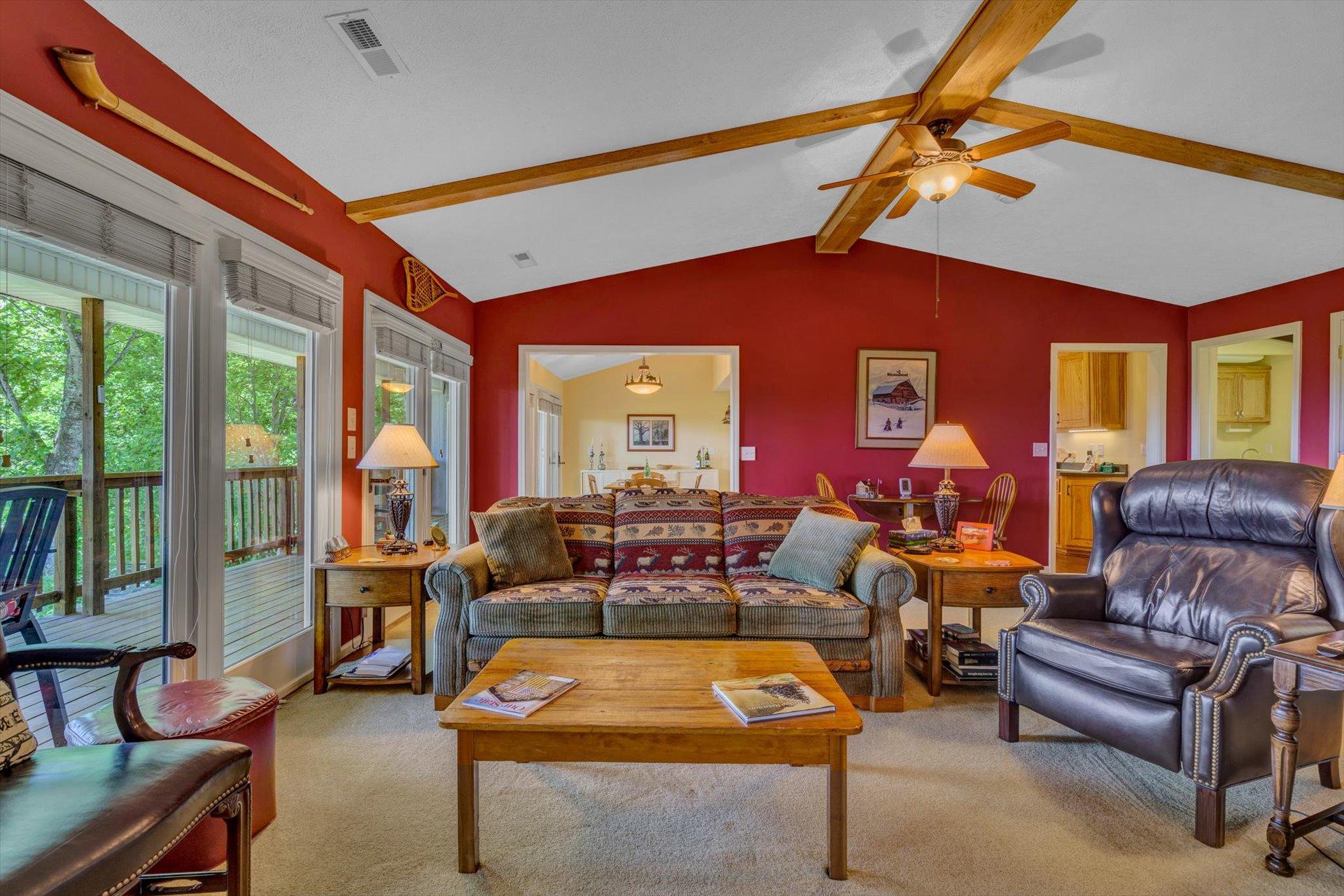 2005 Walnut Knob Road Southeast Floyd, VA 24091 - Photo 17 of 71 a living room with furniture a ceiling fan and a fireplace