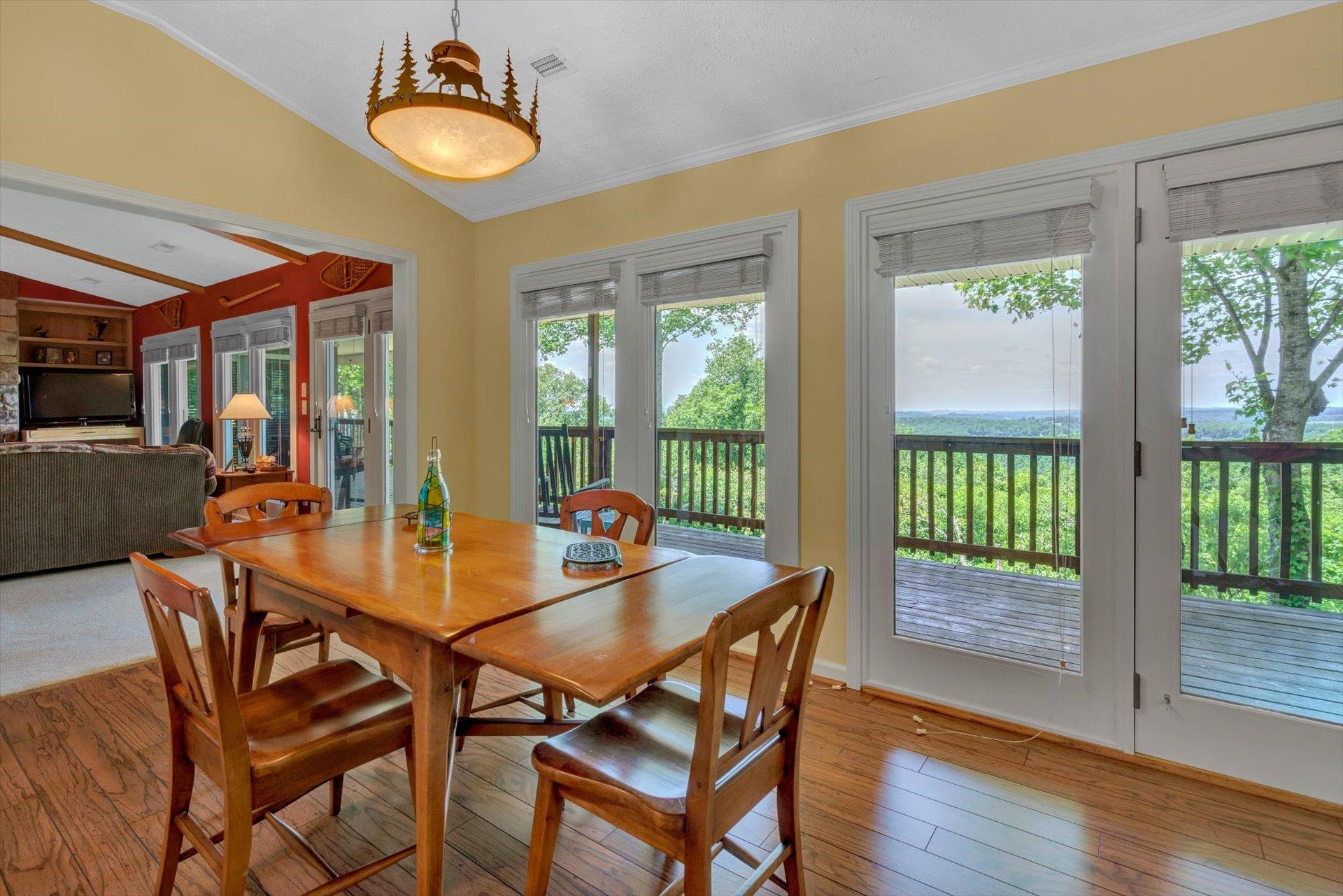 2005 Walnut Knob Road Southeast Floyd, VA 24091 - Photo 20 of 71 a view of a dining room with furniture wooden floor and chandelier