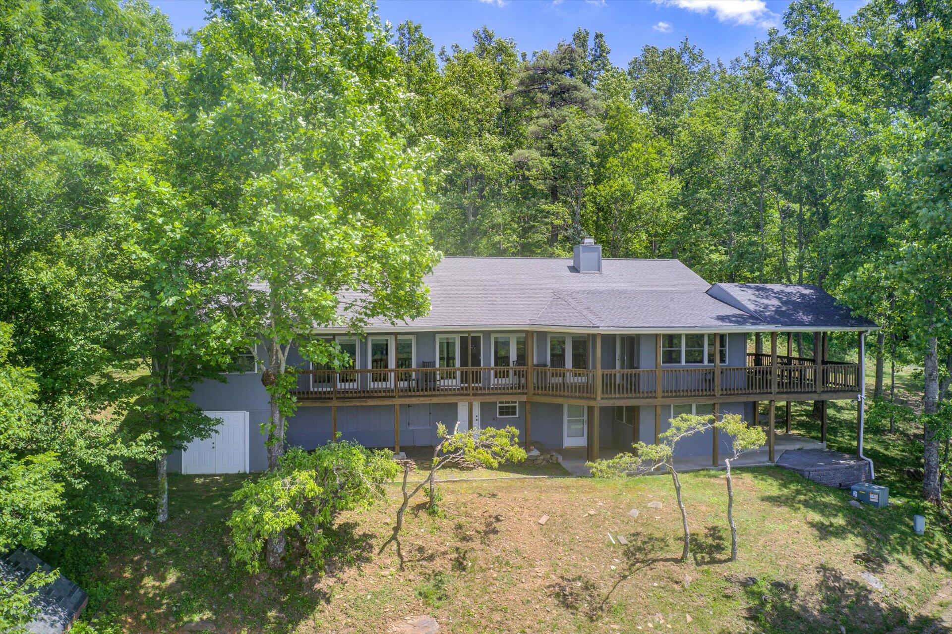 2005 Walnut Knob Road Southeast Floyd, VA 24091 - Photo 3 of 71 a front view of a house with swimming pool