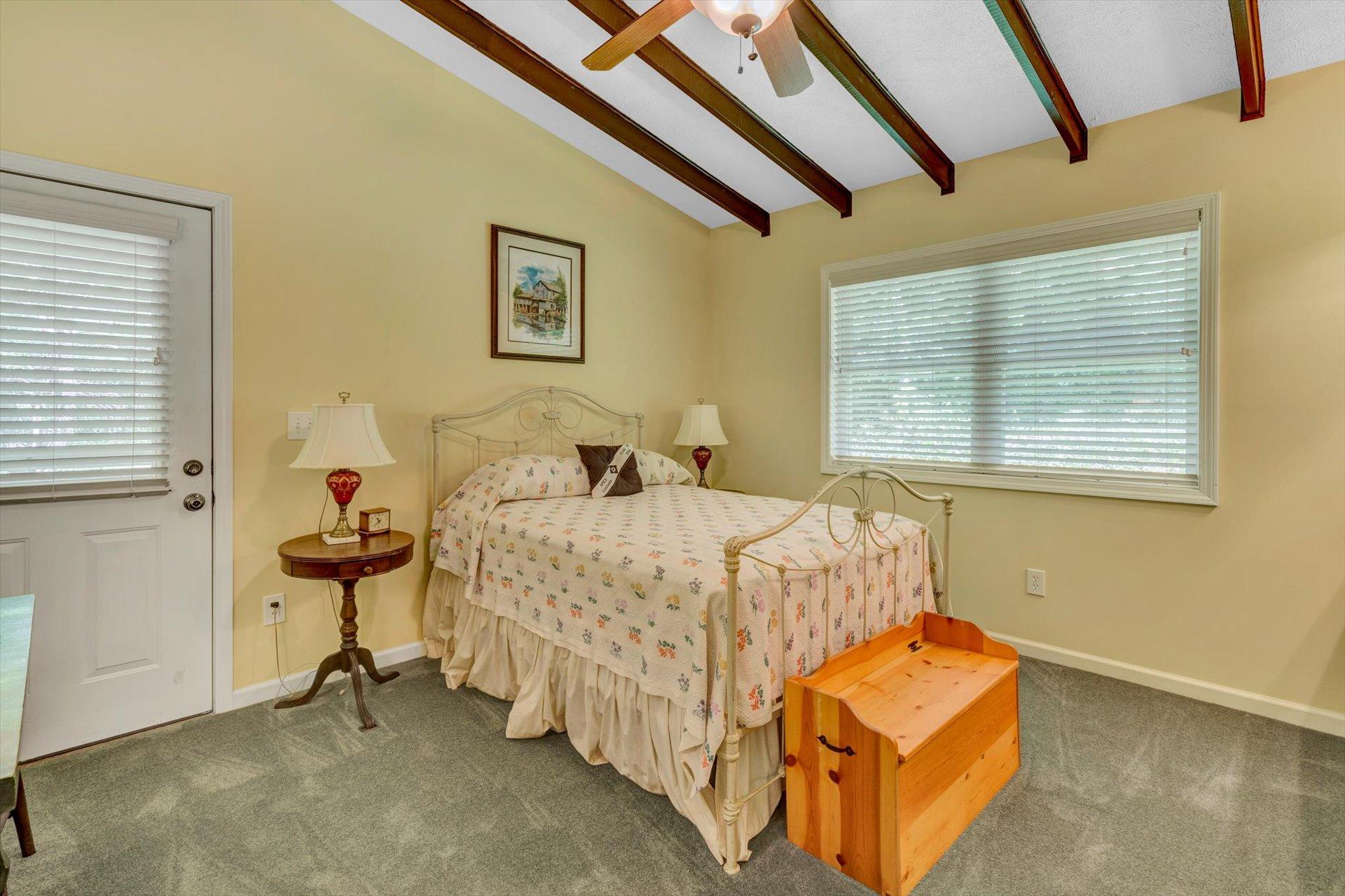2005 Walnut Knob Road Southeast Floyd, VA 24091 - Photo 25 of 71 a bedroom with a bed and wooden floor