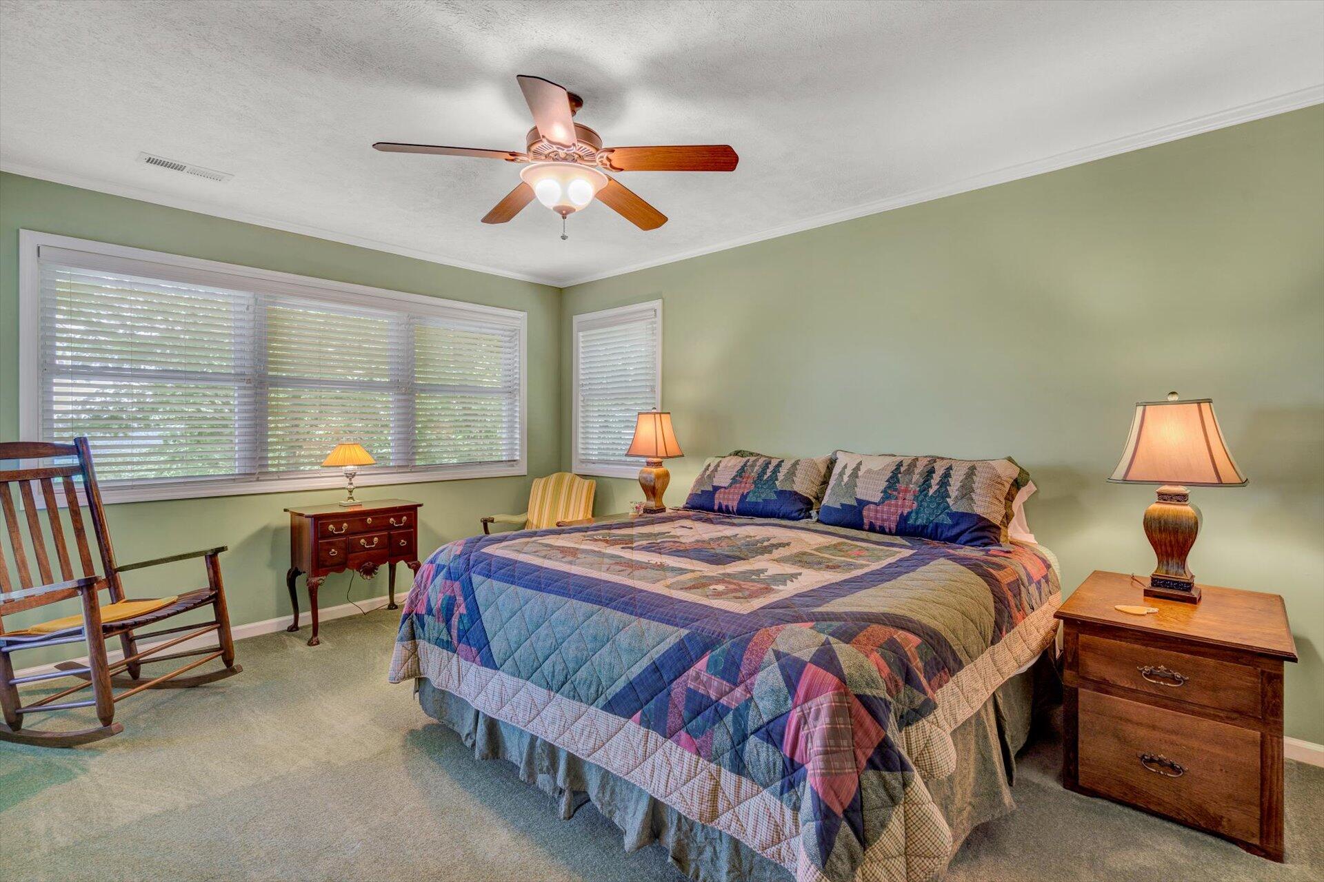 2005 Walnut Knob Road Southeast Floyd, VA 24091 - Photo 27 of 71 a bedroom with a bed and a chandelier