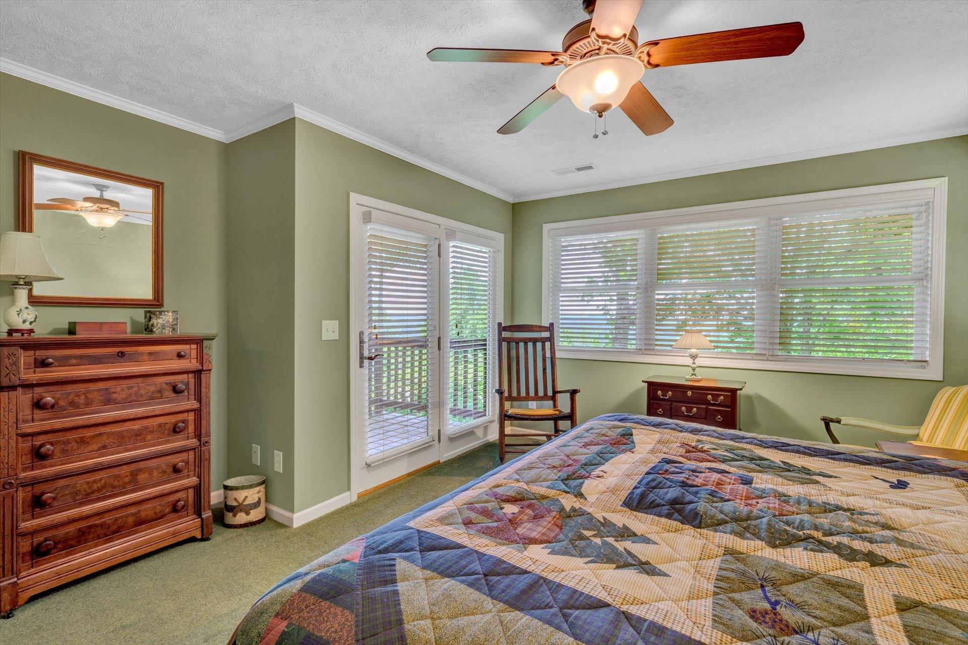 2005 Walnut Knob Road Southeast Floyd, VA 24091 - Photo 28 of 71 a bedroom with a bed and a chandelier